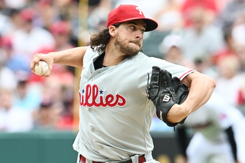 Jul 23, 2023; Cleveland, Ohio, USA; Philadelphia Phillies starting pitcher Aaron Nola (27) throws a pitch during the first inning against the Cleveland Guardians at Progressive Field. Mandatory Credit: Ken Blaze-USA TODAY Sports