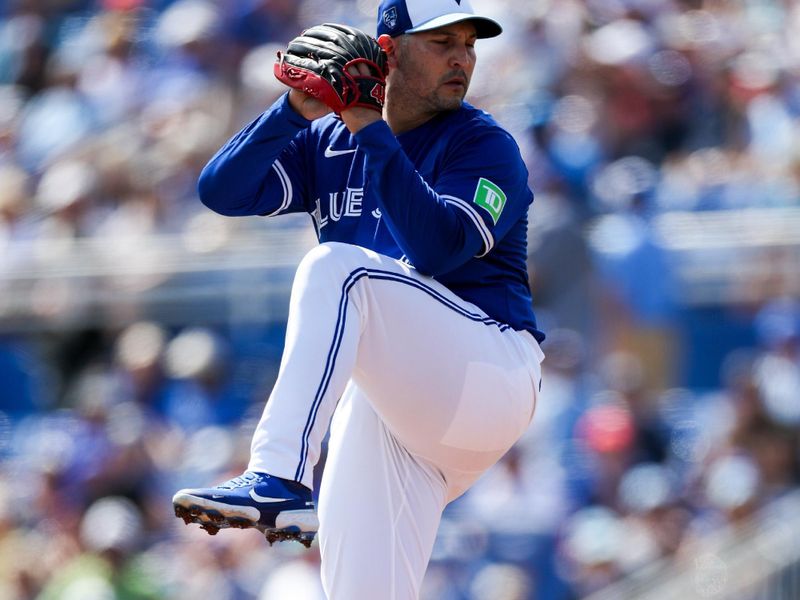 Feb 28, 2024; Dunedin, Florida, USA;  Toronto Blue Jays pitcher Paolo Espino (52) throws a pitch against the Tampa Bay Rays in the first inning at TD Ballpark. Mandatory Credit: Nathan Ray Seebeck-USA TODAY Sports