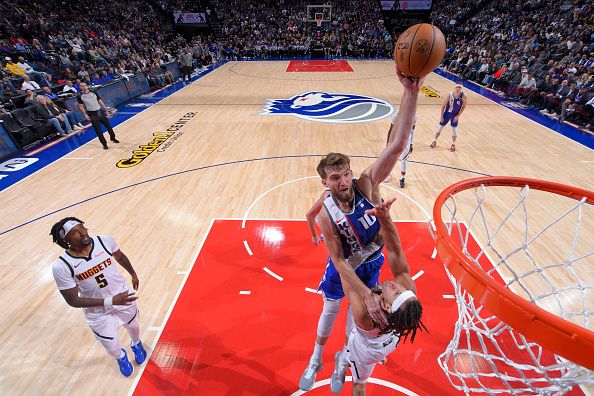 SACRAMENTO, CA - DECEMBER 2: Domantas Sabonis #10 of the Sacramento Kings drives to the basket during the game against the Denver Nuggets on December 2, 2023 at Golden 1 Center in Sacramento, California. NOTE TO USER: User expressly acknowledges and agrees that, by downloading and or using this Photograph, user is consenting to the terms and conditions of the Getty Images License Agreement. Mandatory Copyright Notice: Copyright 2023 NBAE (Photo by Rocky Widner/NBAE via Getty Images)