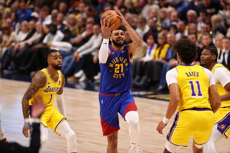 DENVER, CO - OCTOB24ER : Jamal Murray #27 of the Denver Nuggets drives to the basket during the game against the Los Angeles Lakers on October 24, 2023 at the Ball Arena in Denver, Colorado. NOTE TO USER: User expressly acknowledges and agrees that, by downloading and/or using this Photograph, user is consenting to the terms and conditions of the Getty Images License Agreement. Mandatory Copyright Notice: Copyright 2023 NBAE (Photo by Jamie Schwaberow/NBAE via Getty Images)