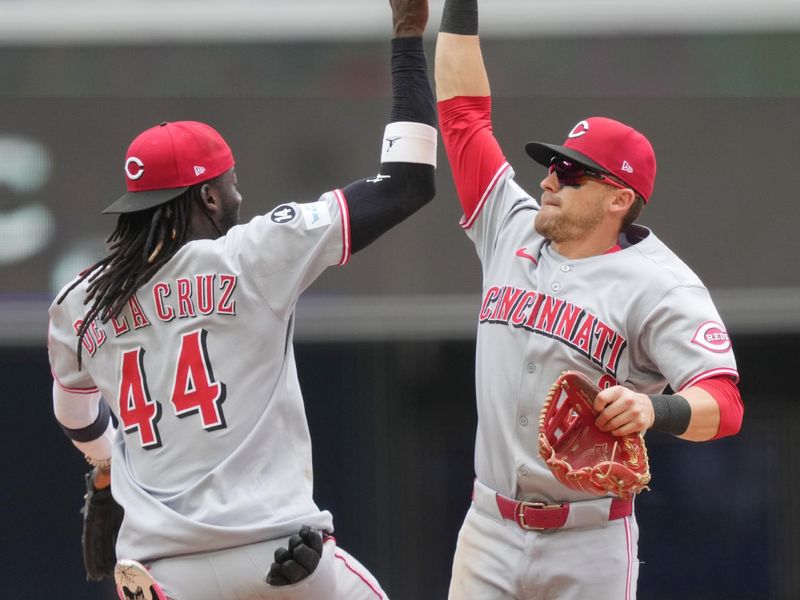 Apr 23, 2025; Miami, Florida, USA;  Cincinnati Reds center fielder TJ Friedl (29) and shortstop Elly De La Cruz (44) celebrate a victory over the Miami Marlins at loanDepot Park. Mandatory Credit: Jim Rassol-Imagn Images
