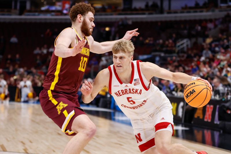 Mar 8, 2023; Chicago, IL, USA; Nebraska Cornhuskers guard Sam Griesel (5) drives to the basket against Minnesota Golden Gophers forward Jamison Battle (10) during the second half at United Center. Mandatory Credit: Kamil Krzaczynski-USA TODAY Sports