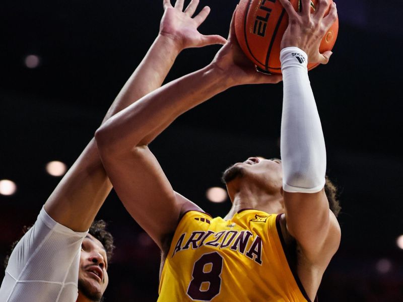 Mar 4, 2025; Tucson, Arizona, USA; Arizona Wildcats forward Trey Townsend (4) fouls Arizona State Sun Devils forward Basheer Jihad (8) during the first half at McKale Center. Mandatory Credit: Aryanna Frank-Imagn Images