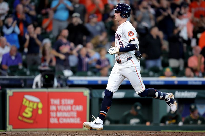 May 28, 2025; Houston, Texas, USA; Houston Astros designated hitter Zach Dezenzo (9) crosses home plate after hitting a home run to center field against the Athletics during the seventh inning at Daikin Park. Mandatory Credit: Erik Williams-Imagn Images