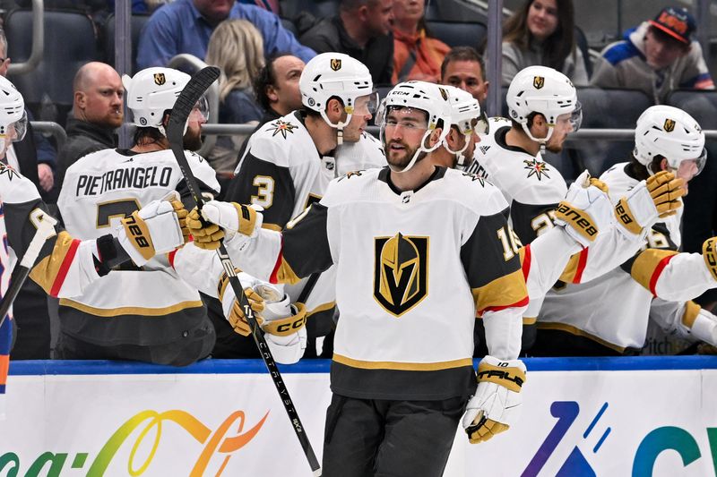 Jan 23, 2024; Elmont, New York, USA;  Vegas Golden Knights center Nicolas Roy (10) celebrates his goal against the New York Islanders with the Vegas Golden Knights bench during the second period at UBS Arena. Mandatory Credit: Dennis Schneidler-USA TODAY Sports