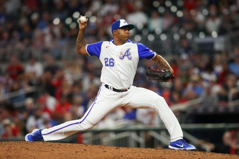 May 6, 2023; Atlanta, Georgia, USA; Atlanta Braves relief pitcher Raisel Iglesias (26) throws against the Baltimore Orioles in the ninth inning at Truist Park. Mandatory Credit: Brett Davis-USA TODAY Sports