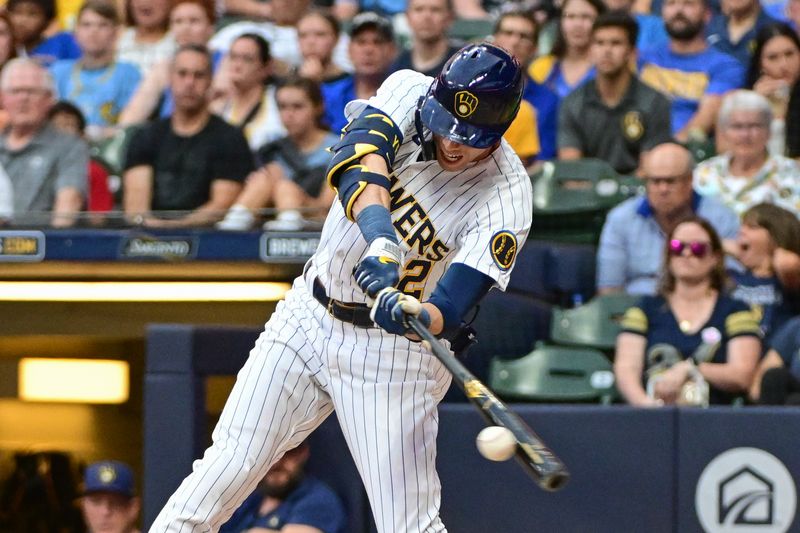 Sep 2, 2023; Milwaukee, Wisconsin, USA;  Milwaukee Brewers designated hitter Christian Yelich (22) hits a single to drive in a run in the second inning against the Philadelphia Phillies at American Family Field. Mandatory Credit: Benny Sieu-USA TODAY Sports