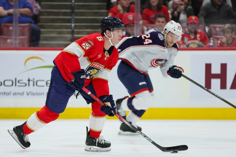 Nov 6, 2023; Sunrise, Florida, USA; Florida Panthers defenseman Mike Reilly (6) moves the puck against the Columbus Blue Jackets during the first period at Amerant Bank Arena. Mandatory Credit: Sam Navarro-USA TODAY Sports