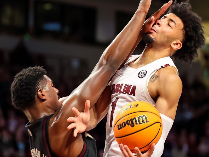 Jan 14, 2023; Columbia, South Carolina, USA; South Carolina Gamecocks guard Jacobi Wright (1) is fouled by Texas A&M Aggies forward Henry Coleman III (15) in the first half at Colonial Life Arena. Mandatory Credit: Jeff Blake-USA TODAY Sports