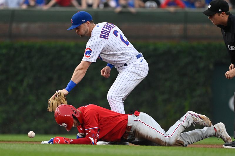 Jun 29, 2023; Chicago, Illinois, USA;  Chicago Cubs second baseman Nico Hoerner (2) misses the tag on Philadelphia Phillies shortstop Trea Turner (7) during the first inning at Wrigley Field. Mandatory Credit: Matt Marton-USA TODAY Sports