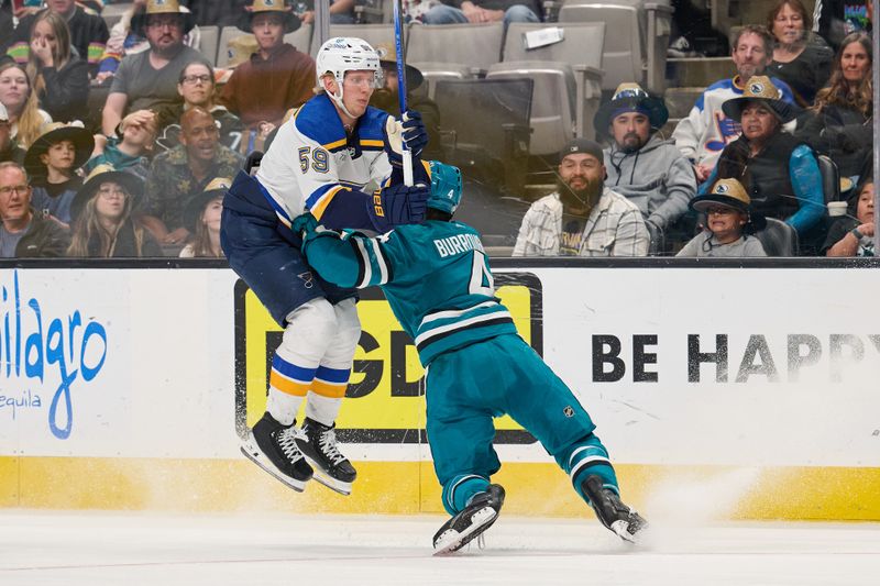 Apr 6, 2024; San Jose, California, USA; St. Louis Blues center Nikita Alexandrov (59) leaps against San Jose Sharks defenseman Kyle Burroughs (4) during the third period at SAP Center at San Jose. Mandatory Credit: Robert Edwards-USA TODAY Sports