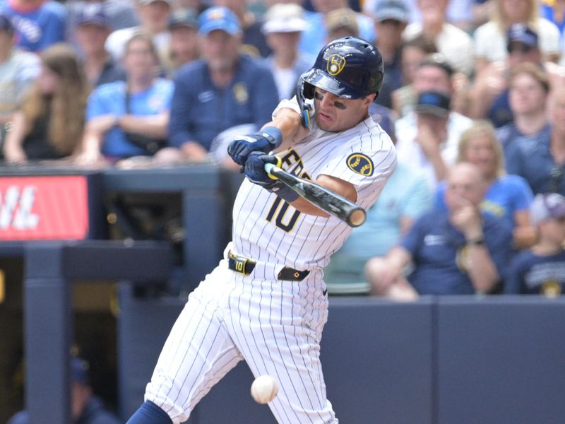 Jun 29, 2024; Milwaukee, Wisconsin, USA; Milwaukee Brewers outfielder Sal Frelick (10) hits a ground ball for a base hit in the third inning against the Chicago Cubs at American Family Field. Mandatory Credit: Michael McLoone-USA TODAY Sports