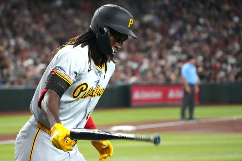 Jul 27, 2024; Phoenix, Arizona, USA; Pittsburgh Pirates shortstop Oneil Cruz (15) slams his bat after hitting a solo home run against the Arizona Diamondbacks during the first inning at Chase Field. Mandatory Credit: Joe Camporeale-USA TODAY Sports