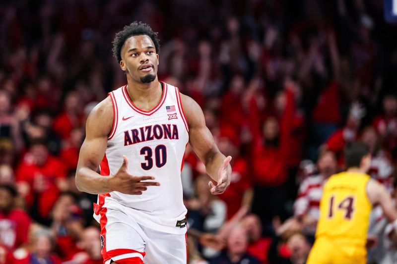 Jan 14, 2026; Tucson, Arizona, USA; Arizona Wildcats forward Tobe Awaka (30) reacts after he made a three point shot during the first half of the game against the Arizona State Sun Devils at McKale Memorial Center. Mandatory Credit: Aryanna Frank-Imagn Images
