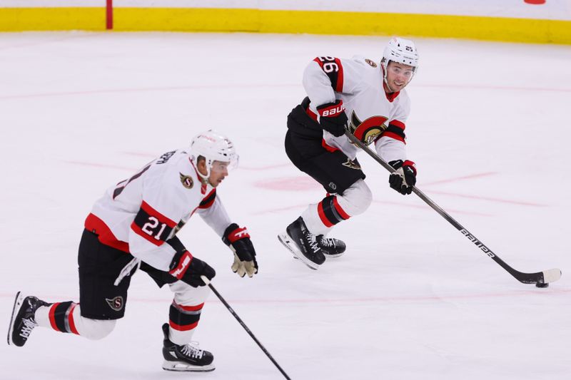 Apr 9, 2024; Sunrise, Florida, USA; Ottawa Senators defenseman Erik Brannstrom (26) moves the puck against the Florida Panthers during the third period at Amerant Bank Arena. Mandatory Credit: Sam Navarro-USA TODAY Sports