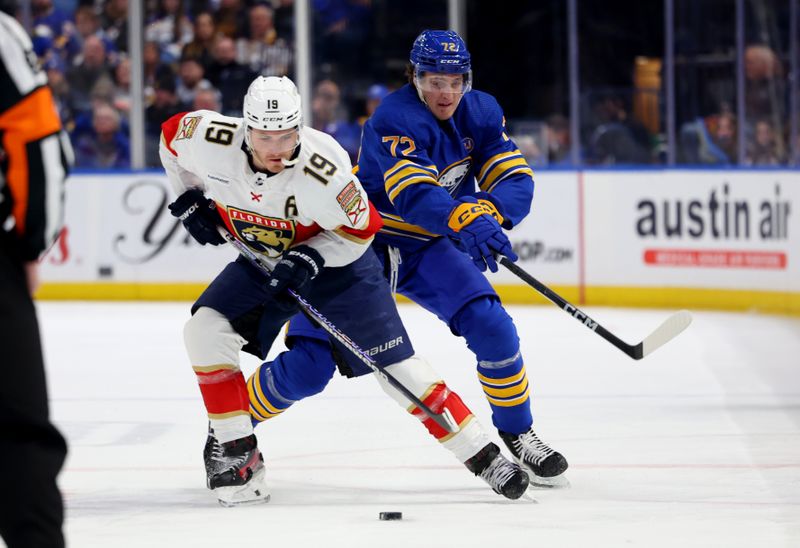 Feb 15, 2024; Buffalo, New York, USA;  Florida Panthers left wing Matthew Tkachuk (19) carries the puck up ice as Buffalo Sabres right wing Tage Thompson (72) defends during the first period at KeyBank Center. Mandatory Credit: Timothy T. Ludwig-USA TODAY Sports