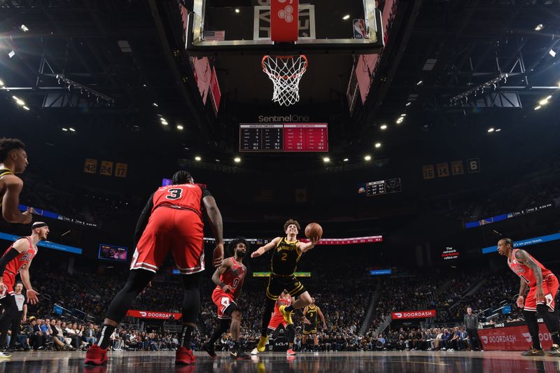 SAN FRANCISCO, CA - MARCH 7:  Brandin Podziemski #2 of the Golden State Warriors drives to the basket during the game against the Chicago Bulls on March 7, 2024 at Chase Center in San Francisco, California. NOTE TO USER: User expressly acknowledges and agrees that, by downloading and or using this photograph, user is consenting to the terms and conditions of Getty Images License Agreement. Mandatory Copyright Notice: Copyright 2024 NBAE (Photo by Noah Graham/NBAE via Getty Images)