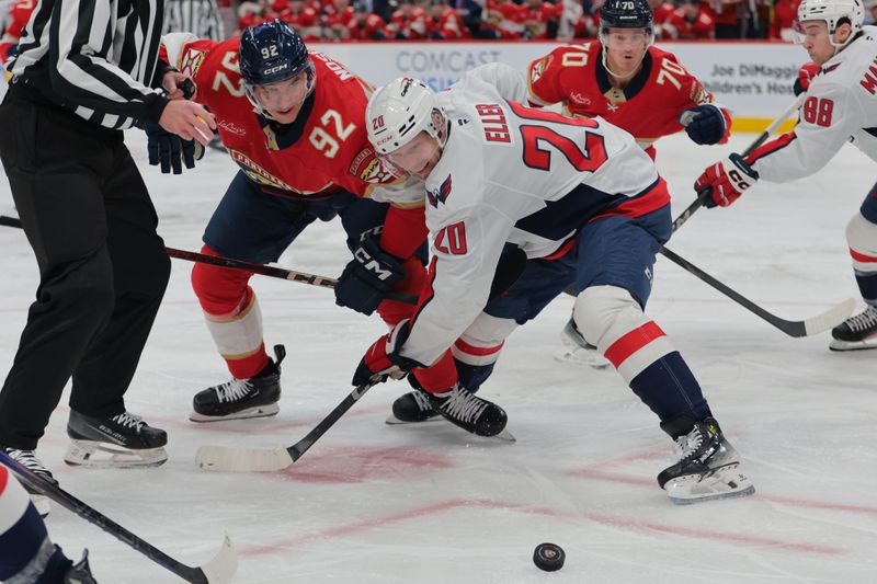 Nov 25, 2024; Sunrise, Florida, USA; Florida Panthers left wing Tomas Nosek (92) and Washington Capitals center Lars Eller (20) face-off during the second period at Amerant Bank Arena. Mandatory Credit: Sam Navarro-Imagn Images