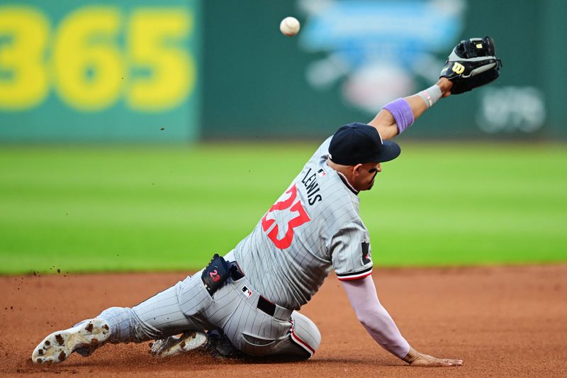 Sep 16, 2024; Cleveland, Ohio, USA; Minnesota Twins third baseman Royce Lewis (23) misses a ball hit by Cleveland Guardians left fielder Angel Martinez (not pictured) during the first inning at Progressive Field. Mandatory Credit: Ken Blaze-Imagn Images