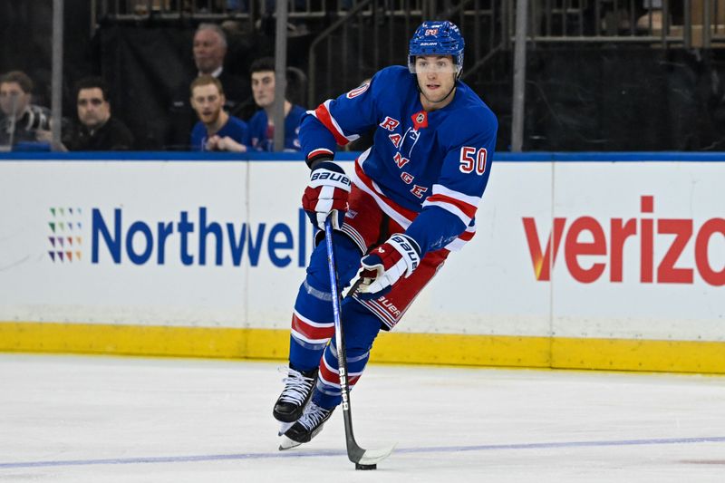 Oct 14, 2024; New York, New York, USA;  New York Rangers left wing Will Cuylle (50) skates with the puck against the Detroit Red Wings during the first period at Madison Square Garden. Mandatory Credit: Dennis Schneidler-Imagn Images