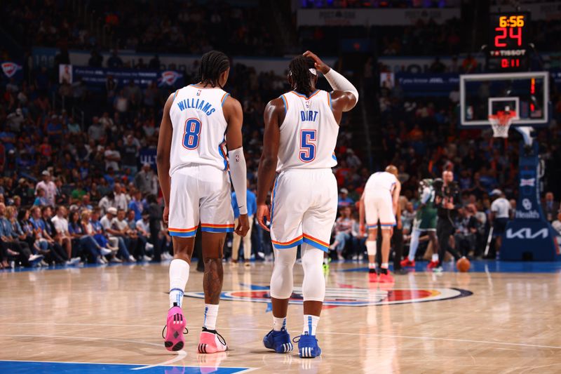OKLAHOMA CITY, OK - APRIL 12: Jalen Williams #8 of the Oklahoma City Thunder and Luguentz Dort #5 of the Oklahoma City Thunder look on during the game against the Milwaukee Bucks on April 12, 2024 at Paycom Arena in Oklahoma City, Oklahoma. NOTE TO USER: User expressly acknowledges and agrees that, by downloading and or using this photograph, User is consenting to the terms and conditions of the Getty Images License Agreement. Mandatory Copyright Notice: Copyright 2024 NBAE (Photo by Zach Beeker/NBAE via Getty Images)