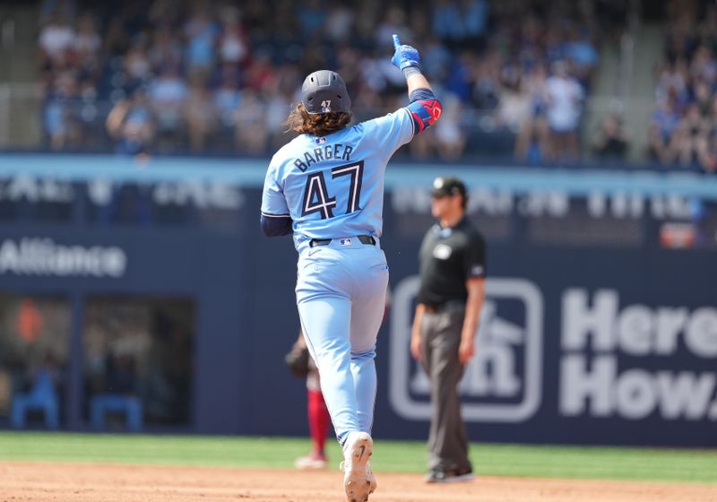 Aug 25, 2024; Toronto, Ontario, CAN; Toronto Blue Jays right fielder Addison Barger (47) runs the bases and celebrates after hitting a two run home run against the Los Angeles Angels during the sixth inning at Rogers Centre. Mandatory Credit: Nick Turchiaro-USA TODAY Sports
