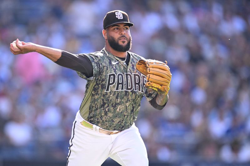Aug 6, 2023; San Diego, California, USA; San Diego Padres relief pitcher Pedro Avila (60) throws to first base on a ground out by Los Angeles Dodgers center fielder James Outman (not pictured) during the fifth inning at Petco Park. Mandatory Credit: Orlando Ramirez-USA TODAY Sports