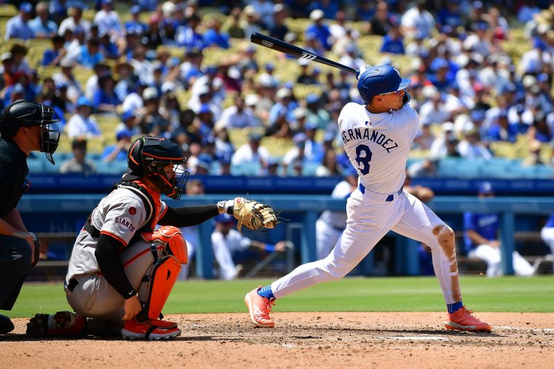 Jul 25, 2024; Los Angeles, California, USA; Los Angeles Dodgers third baseman Enrique Hernández (8) hits an RBI double against the San Francisco Giants during the fourth inning at Dodger Stadium. Mandatory Credit: Gary A. Vasquez-USA TODAY Sports