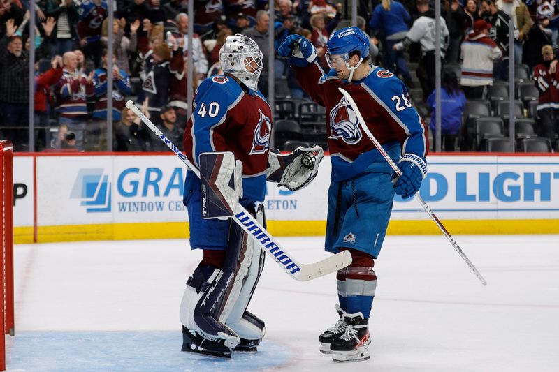 Jan 26, 2024; Denver, Colorado, USA; Colorado Avalanche goaltender Alexandar Georgiev (40) and left wing Miles Wood (28) celebrate after the game against the Los Angeles Kings at Ball Arena. Mandatory Credit: Isaiah J. Downing-USA TODAY Sports