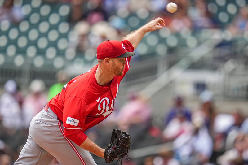 Jul 24, 2024; Cumberland, Georgia, USA; Cincinnati Reds relief pitcher Justin Wilson (32) pitches against the Atlanta Braves during the ninth inning at Truist Park. Mandatory Credit: Dale Zanine-USA TODAY Sports