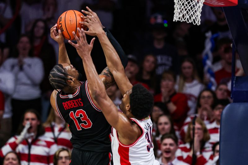 Feb 15, 2025; Tucson, Arizona, USA; Arizona Wildcats forward Tobe Awaka (30) attempts to block Houston Cougar forward J’Wan Roberts (13) during the second half at McKale Center. Mandatory Credit: Aryanna Frank-Imagn Images