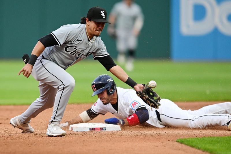 Apr 9, 2024; Cleveland, Ohio, USA; Cleveland Guardians right fielder Ramon Laureano (10) steals second as Chicago White Sox second baseman Lenyn Sosa (50) can not catch the ball from catcher Martin Maldonado (not pictured) during the fourth inning at Progressive Field. Mandatory Credit: Ken Blaze-USA TODAY Sports