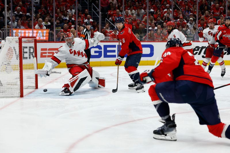 May 8, 2025; Washington, District of Columbia, USA; Washington Capitals defenseman John Carlson (74) scores a goal on Carolina Hurricanes goaltender Frederik Andersen (31) in the third period in game two of the second round of the 2025 Stanley Cup Playoffs at Capital One Arena. Mandatory Credit: Geoff Burke-Imagn Images