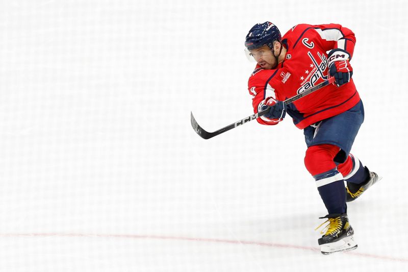 Oct 24, 2023; Washington, District of Columbia, USA; Washington Capitals left wing Alex Ovechkin (8) shoots the puck against the Toronto Maple Leafs in the first period at Capital One Arena. Mandatory Credit: Geoff Burke-USA TODAY Sports