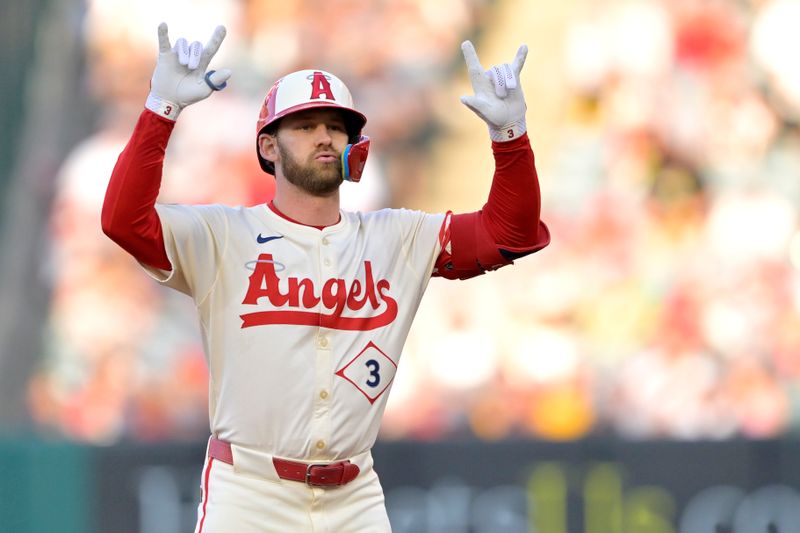 Jul 13, 2024; Anaheim, California, USA;  Taylor Ward #3 of the Los Angeles Angels gestures to the dugout after a double in the first inning against the Seattle Mariners at Angel Stadium. Mandatory Credit: Jayne Kamin-Oncea-USA TODAY Sports