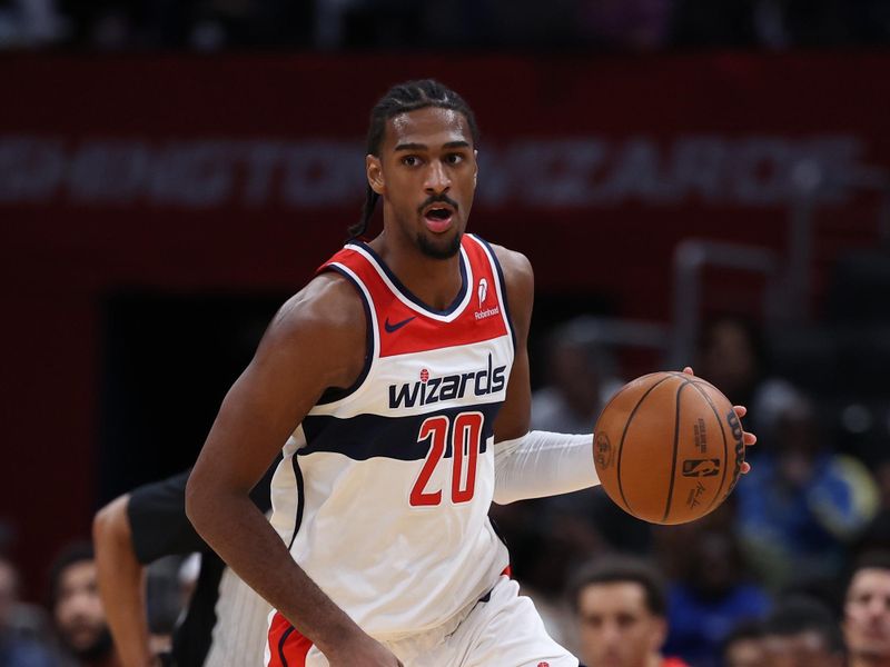 WASHINGTON, DC - OCTOBER 11: Alex Sarr #20 of the Washington Wizards dribbles the ball against the Toronto Raptors during the first half of a preseason game at Capital One Arena on October 11, 2024 in Washington, DC. NOTE TO USER: User expressly acknowledges and agrees that, by downloading and or using this photograph, User is consenting to the terms and conditions of the Getty Images License Agreement. (Photo by Patrick Smith/Getty Images)