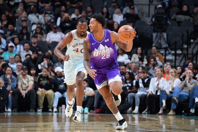 SAN ANTONIO, TX - NOVEMBER 21: Brice Sensabaugh #28 of the Utah Jazz dribbles the ball during the game against the San Antonio Spurs on November 21, 2024 at the Frost Bank Center in San Antonio, Texas. NOTE TO USER: User expressly acknowledges and agrees that, by downloading and or using this photograph, user is consenting to the terms and conditions of the Getty Images License Agreement. Mandatory Copyright Notice: Copyright 2024 NBAE (Photos by Michael Gonzales/NBAE via Getty Images)