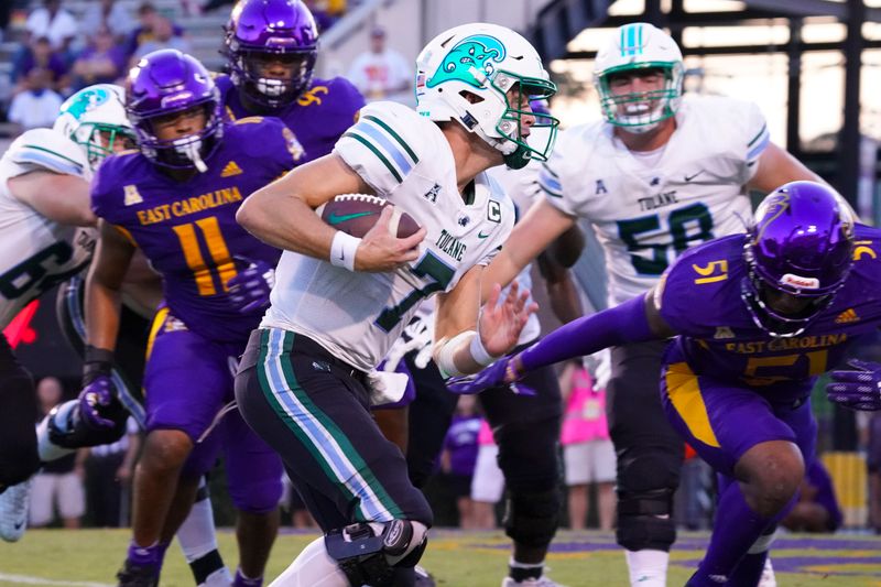 Oct 2, 2021; Greenville, North Carolina, USA;  Tulane Green Wave quarterback Michael Pratt (7) scores a touchdown against the East Carolina Pirates during the second half at Dowdy-Ficklen Stadium. Mandatory Credit: James Guillory-USA TODAY Sports