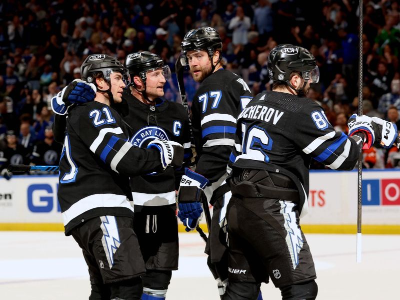 Mar 9, 2024; Tampa, Florida, USA; Tampa Bay Lightning center Brayden Point (21) celebrates after scoring a goal against the Philadelphia Flyers during the first period at Amalie Arena. Mandatory Credit: Kim Klement Neitzel-USA TODAY Sports