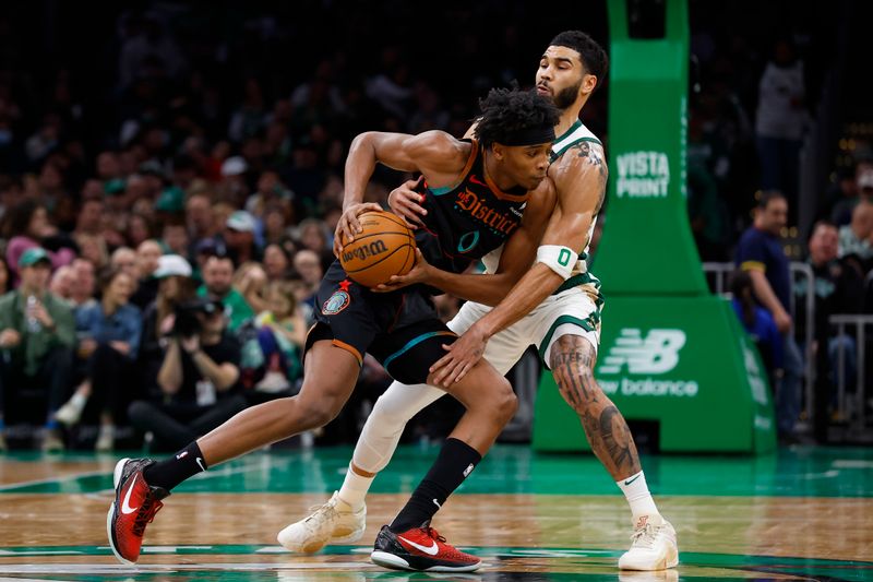 BOSTON, MA - FEBRUARY 9:  Bilal Coulibaly #0 of the Washington Wizards drives against Jayson Tatum #0 of the Boston Celtics during the second quarter at TD Garden on February 9, 2024 in Boston, Massachusetts. NOTE TO USER: User expressly acknowledges and agrees that, by downloading and/or using this Photograph, user is consenting to the terms and conditions of the Getty Images License Agreement. (Photo By Winslow Townson/Getty Images)