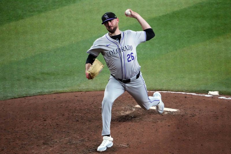 Aug 13, 2024; Phoenix, Arizona, USA; Colorado Rockies pitcher Austin Gomber (26) pitches against the Arizona Diamondbacks during the sixth inning at Chase Field. Mandatory Credit: Joe Camporeale-USA TODAY Sports