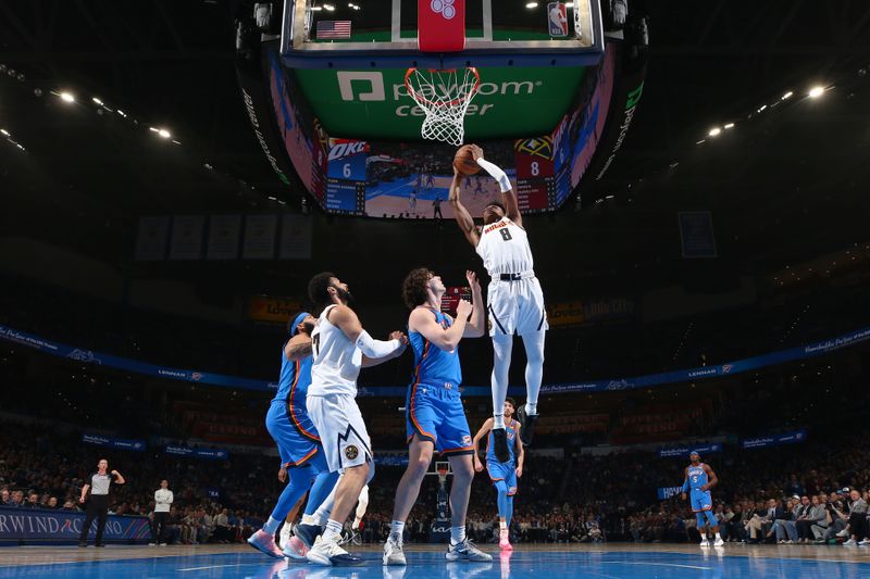 OKLAHOMA CITY, OK - JANUARY 31: Peyton Watson #8 of the Denver Nuggets drives to the basket during the game  against the Oklahoma City Thunder on January 31, 2024 at Paycom Arena in Oklahoma City, Oklahoma. NOTE TO USER: User expressly acknowledges and agrees that, by downloading and or using this photograph, User is consenting to the terms and conditions of the Getty Images License Agreement. Mandatory Copyright Notice: Copyright 2024 NBAE (Photo by Zach Beeker/NBAE via Getty Images)