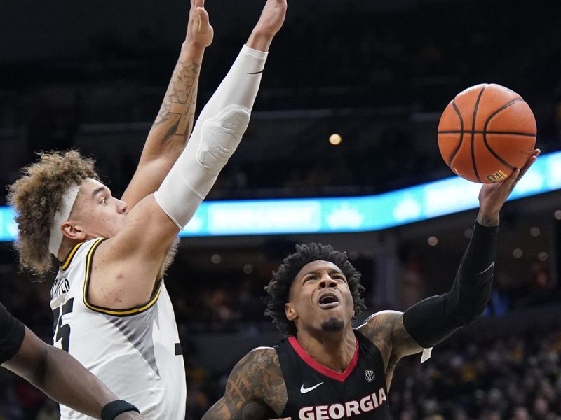 Jan 6, 2024; Columbia, Missouri, USA; Georgia Bulldogs guard Justin Hill (11) shoots as Missouri Tigers forward Noah Carter (35) defends during the second half at Mizzou Arena. Mandatory Credit: Denny Medley-USA TODAY Sports