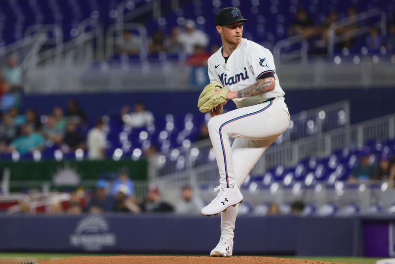 Aug 19, 2024; Miami, Florida, USA; Miami Marlins starting pitcher Adam Oller (77) delivers a pitch against the Arizona Diamondbacks during the first inning at loanDepot Park. Mandatory Credit: Sam Navarro-USA TODAY Sports