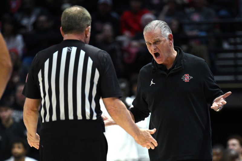 Jan 14, 2023; San Diego, California, USA; San Diego State Aztecs head coach Brian Dutcher (right) reacts during the second half against the New Mexico Lobos at Viejas Arena. Mandatory Credit: Orlando Ramirez-USA TODAY Sports