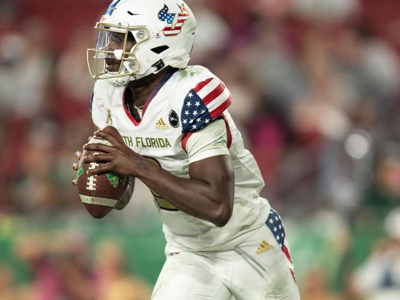 Nov 12, 2021; Tampa, Florida, USA;  South Florida Bulls quarterback Timmy McClain (9) runs with the ball in the 4th quarter against the Cincinnati Bearcats at Raymond James Stadium. Mandatory Credit: Jeremy Reper-USA TODAY Sports