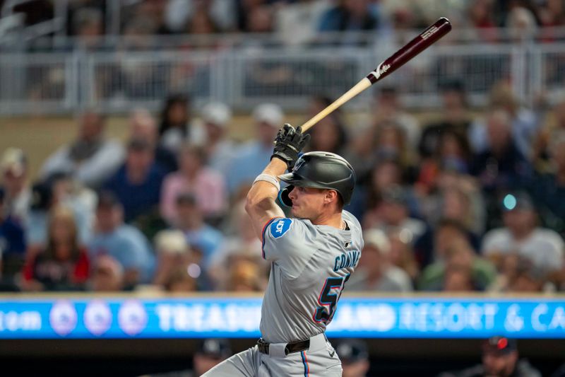 Sep 25, 2024; Minneapolis, Minnesota, USA; Miami Marlins left fielder Griffin Conine (56) hits a single against the Minnesota Twins in the third inning at Target Field. Mandatory Credit: Jesse Johnson-Imagn Images