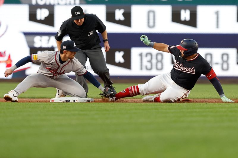 Sep 11, 2024; Washington, District of Columbia, USA; Washington Nationals first baseman Juan Yepez (18) is tagged out at second base by Atlanta Braves second baseman Cavan Biggio (8) during the second inning at Nationals Park. Mandatory Credit: Geoff Burke-Imagn Images