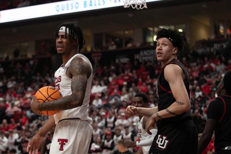 Jan 14, 2026; Lubbock, Texas, USA;  Texas Tech Red Raiders forward JT Toppin (15) and Utah Utes forward James Okonkwo (32) looks to the official to see who has control of the ball in the second half at United Supermarkets Arena. Mandatory Credit: Michael C. Johnson-Imagn Images