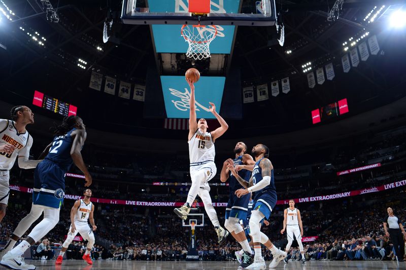 DENVER, CO - FEBRUARY 7: Nikola Jokic #15 of the Denver Nuggets drives to the basket during the game against the Minnesota Timberwolves on February 7, 2023 at the Ball Arena in Denver, Colorado. NOTE TO USER: User expressly acknowledges and agrees that, by downloading and/or using this Photograph, user is consenting to the terms and conditions of the Getty Images License Agreement. Mandatory Copyright Notice: Copyright 2023 NBAE (Photo by Bart Young/NBAE via Getty Images)